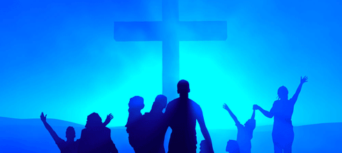 People worshiping before the cross